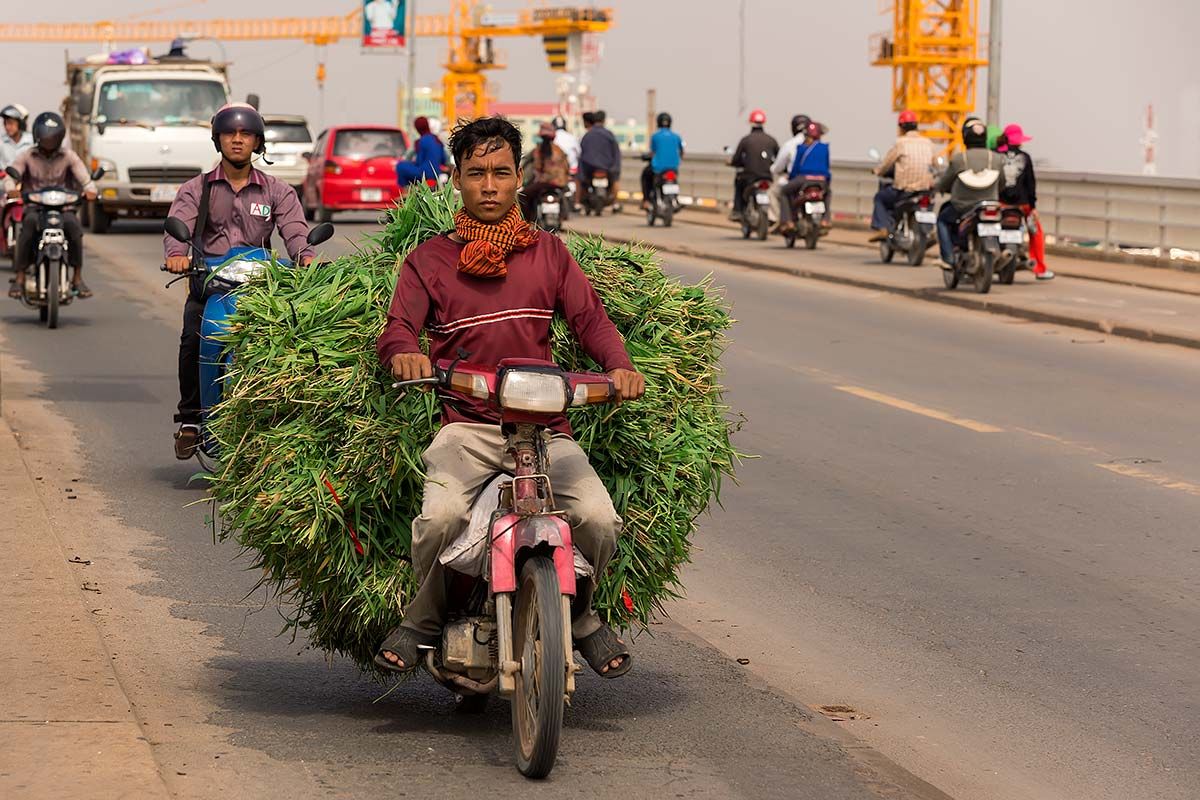 Day in day out, thousands of motorbikes, cars, trucks and walkers cross the bridge out of Phnom Penh.