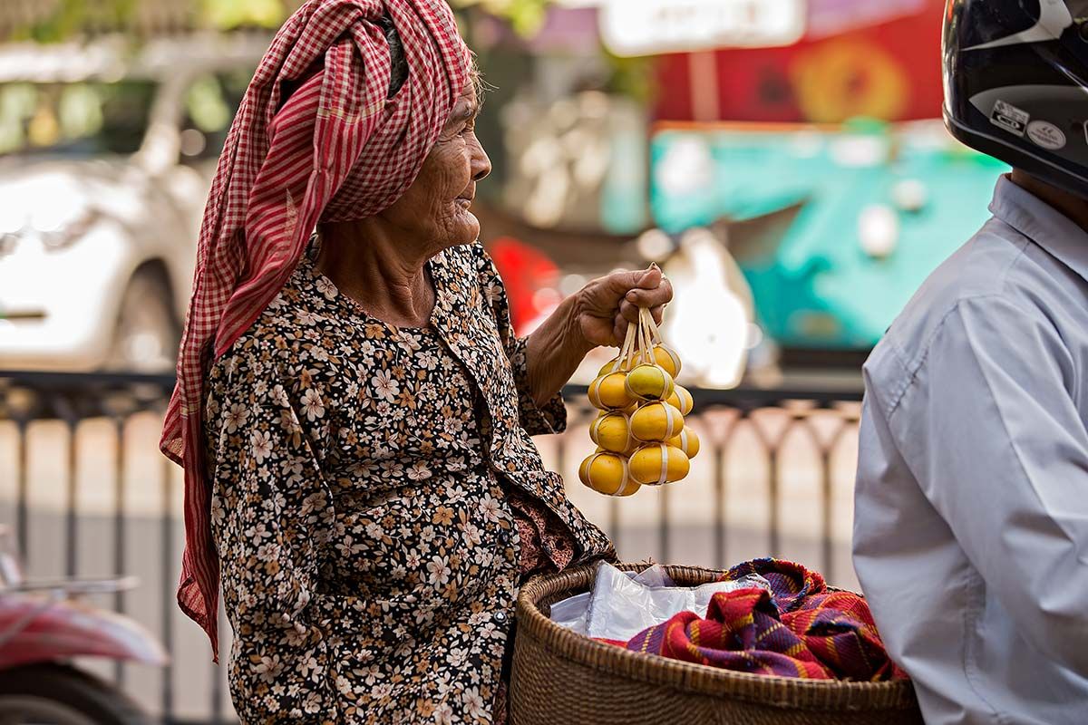 An old woman on her way from the local market in Phnom Penh.