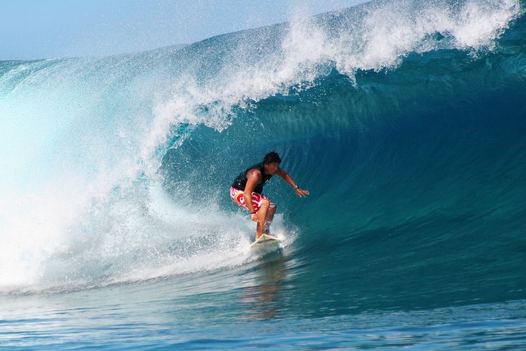 Pro-surfer Raimana Van Bastolaer surfing Teahupoo, Tahiti.