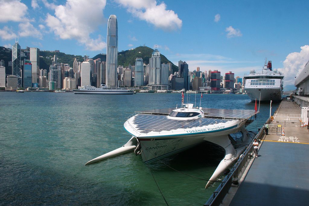 Hong Kong skyline with the ship "PlanetSolar" in Victoria Harbour.