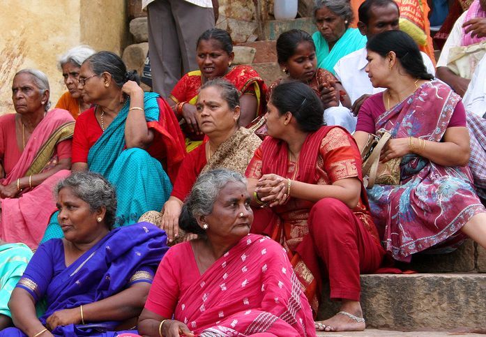 Women sitting on the Ghats in Varanasi.