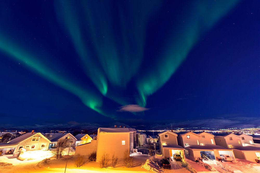Northern Lights over the northern city at night