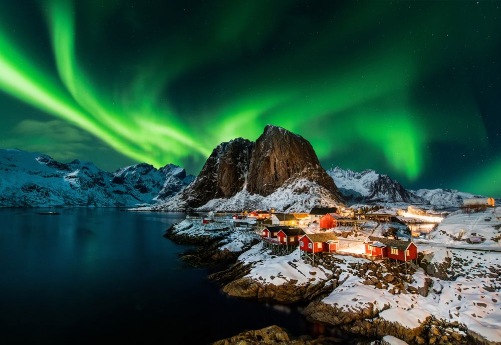 Northern Lights in the sky over a Norwegian town