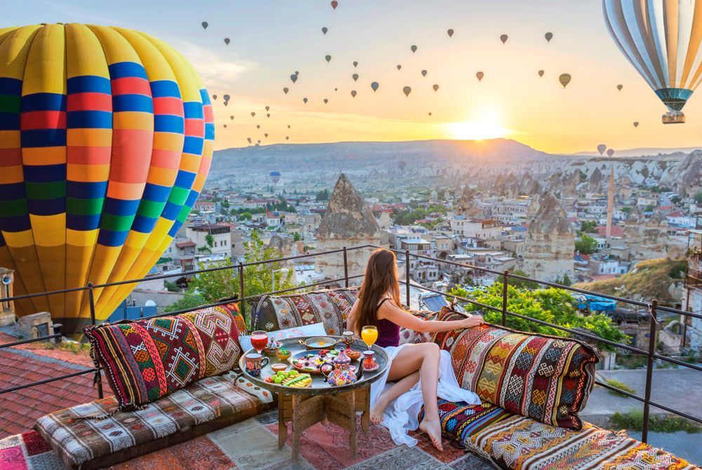View from the terrace of Sultan Cave Suites to the balloons in the sky of Cappadocia